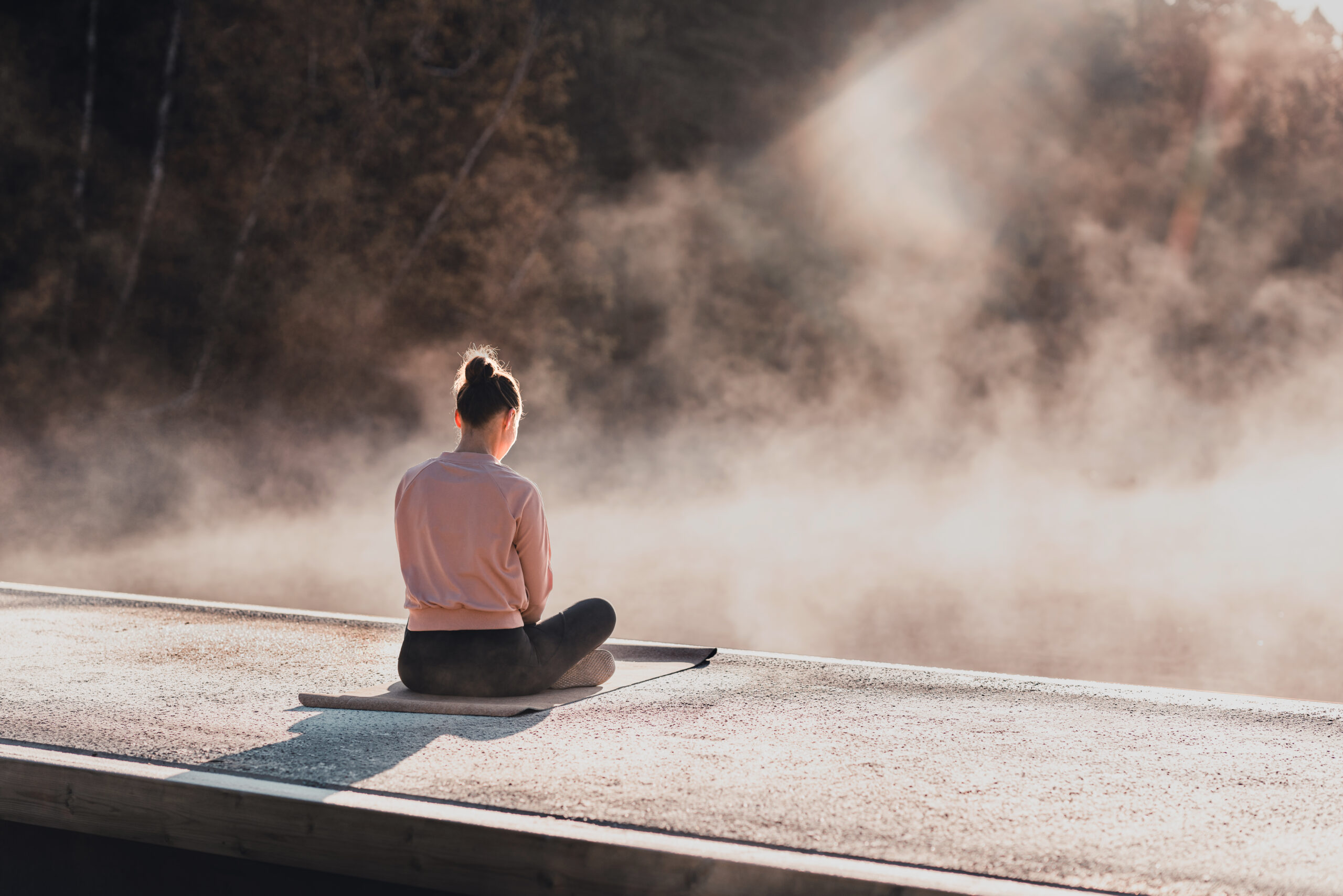 Young woman exercising yoga in the early morning